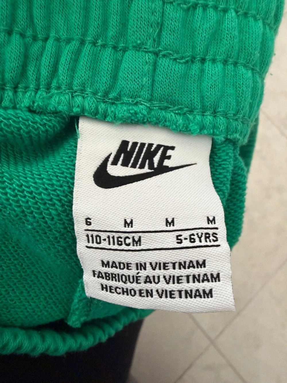 Nike Green Kids Athletic Shorts with White Swoosh - Picture 2 of 4